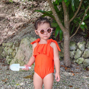 Olivia wearing Cotton Candy from The Baby Dazzle Sunny Summer Kid's Sunglasses Collection